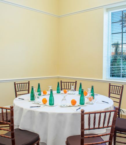meeting set up with water bottles and a notepad