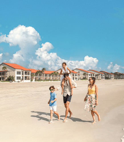 Family Walking Along Shore
