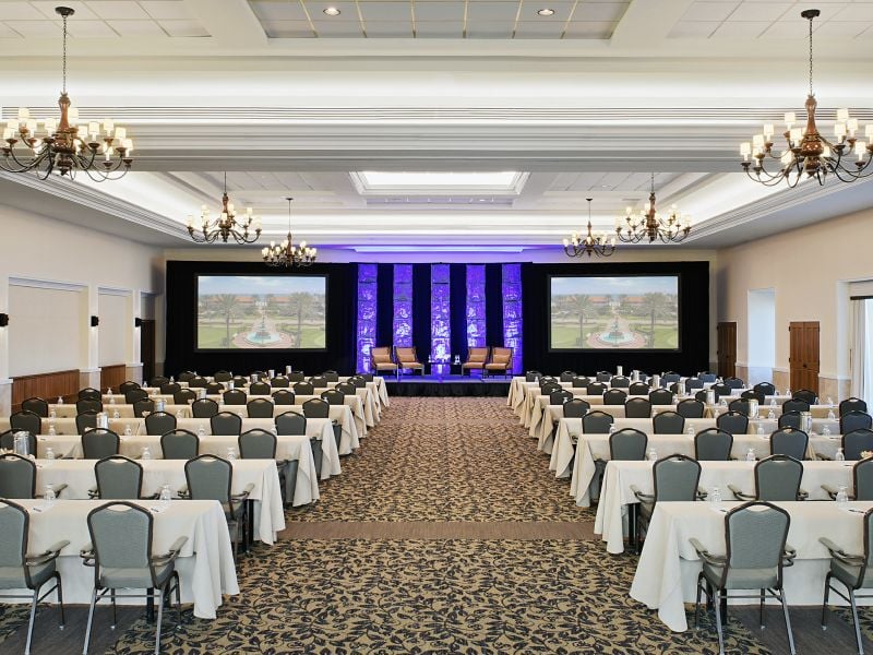 The Ponte Vedra Ballroom with a stage setup and classroom seating at Ponte Vedra Inn & Club.