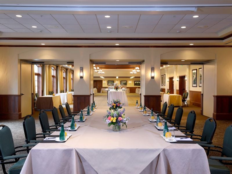 View of a set up meeting table from the end of the table
