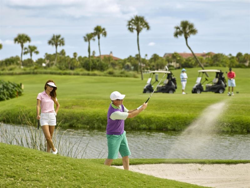couple playing golf