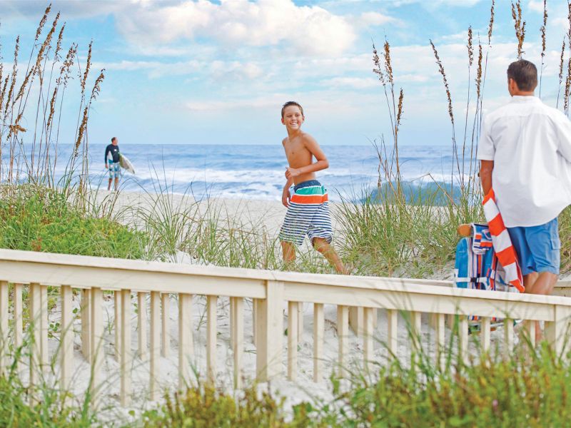 kids running along the beach