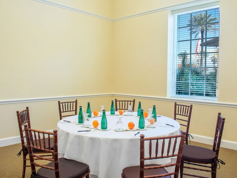 meeting set up with water bottles and a notepad