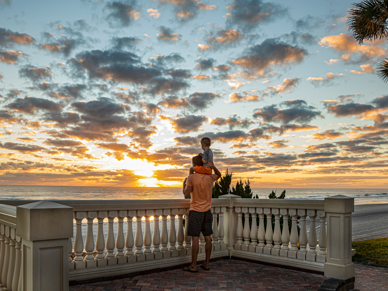 Man and Son Oceanfront Sunrise