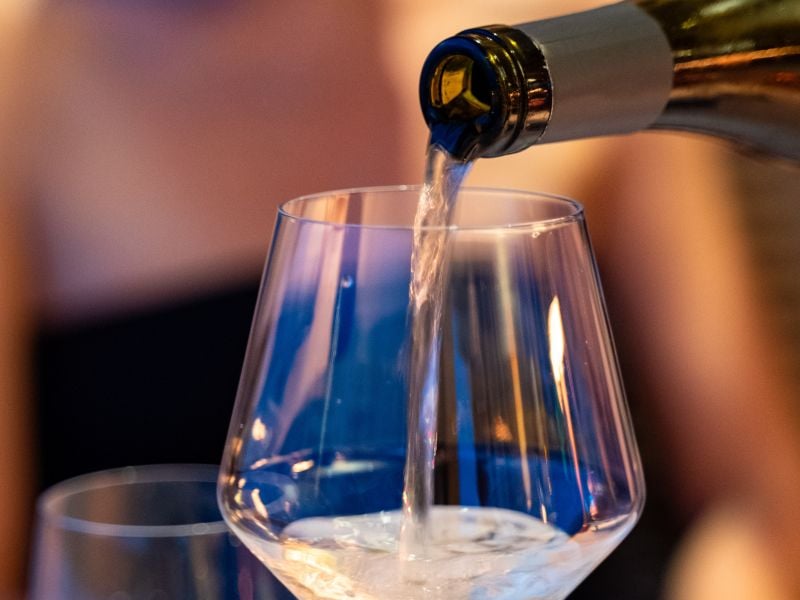 White wine being poured into a glass.