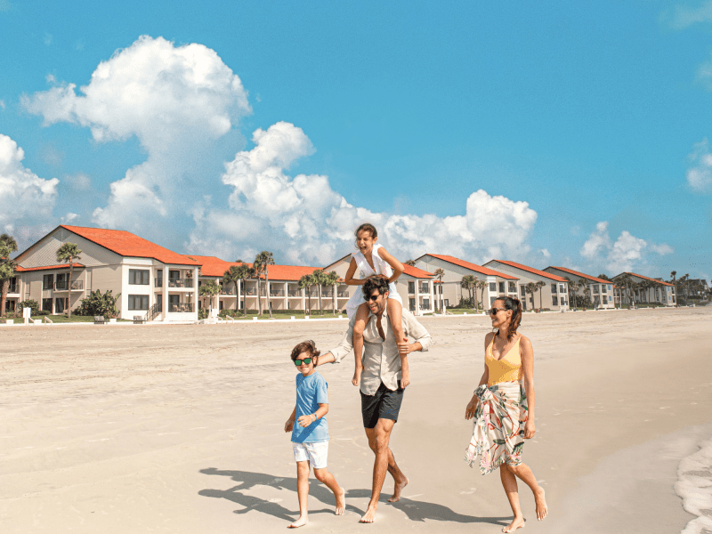 Family Walking Along Shore