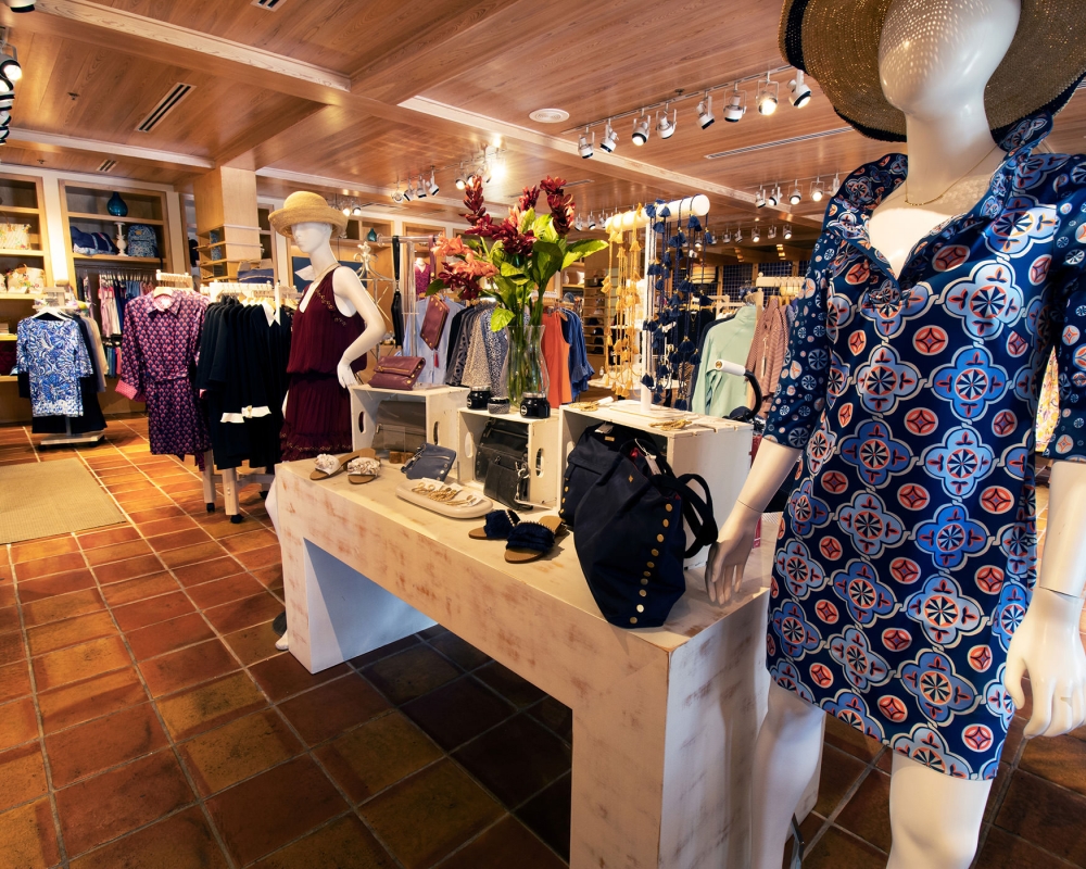 Mannequin wearing a woman's dress at a display table