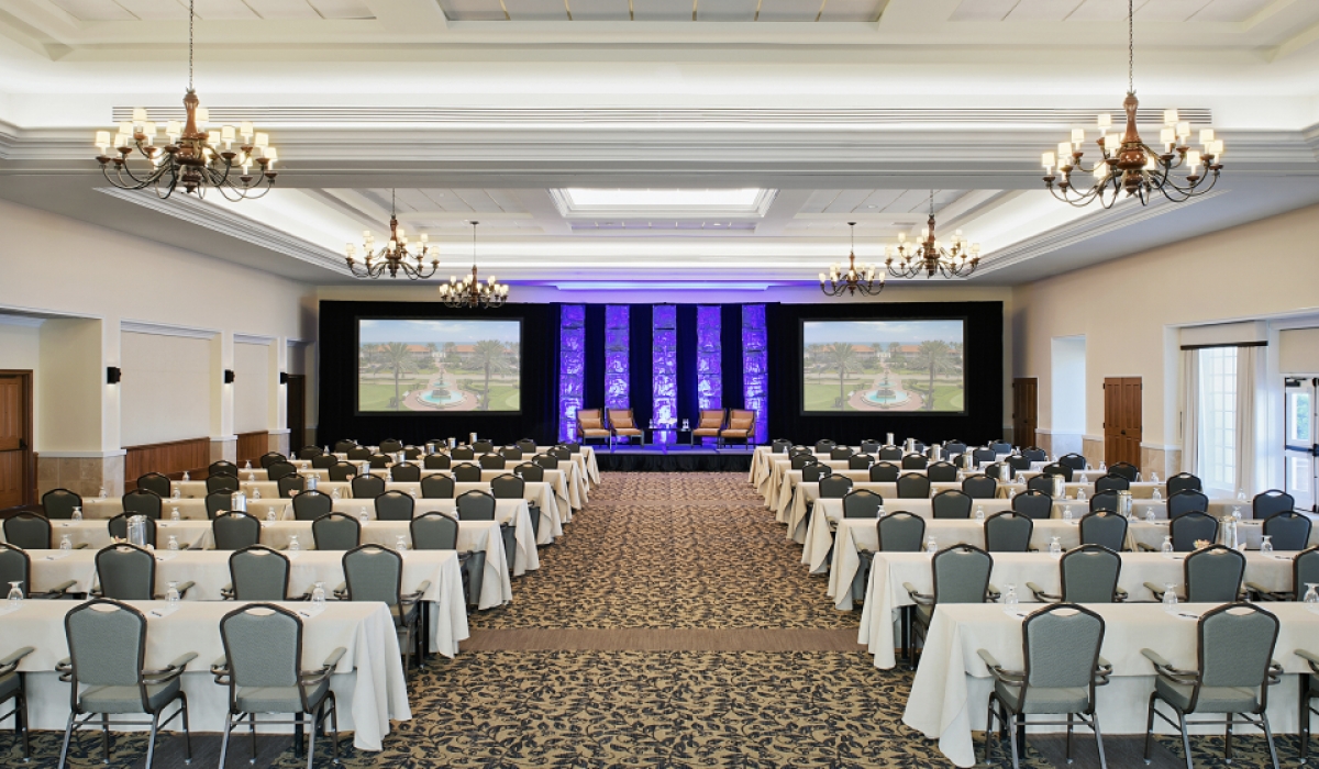 The Ponte Vedra Ballroom with a stage setup and classroom seating at Ponte Vedra Inn & Club.