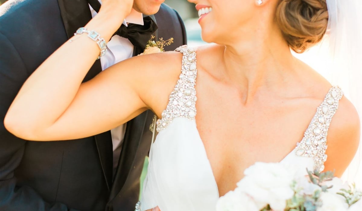 A bride and groom share an embrace during their wedding at Ponte Vedra Inn & Club.