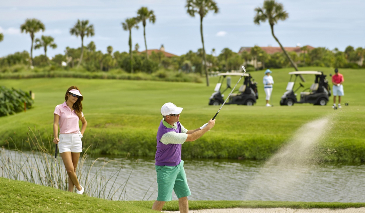 couple playing golf