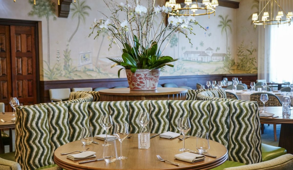 image of a dining room with a booth and two chairs