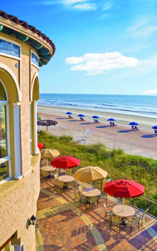 Looking out from the second floor at the exterior of the Sea View Grille and the beach beyond at The Lodge & Club Ponte Vedra Beach.