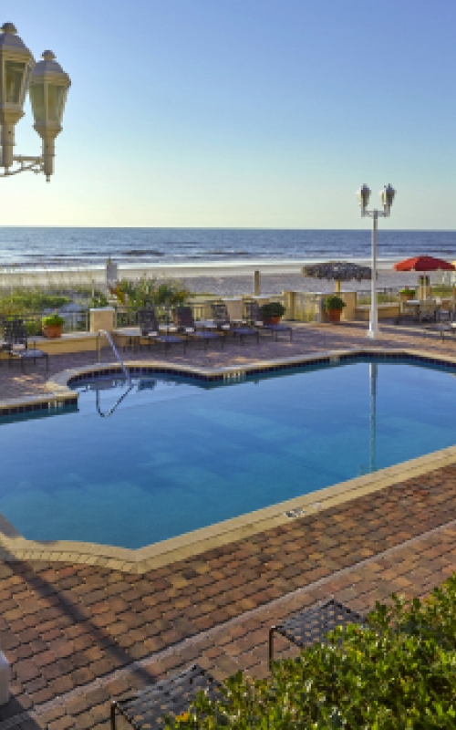 A view of the adults-only pool looking out over the Atlantic Ocean at The Lodge & Club Ponte Vedra Beach