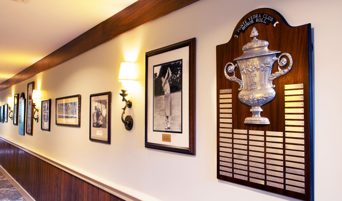 Historic golf photos and plaques on display in the club house hallway