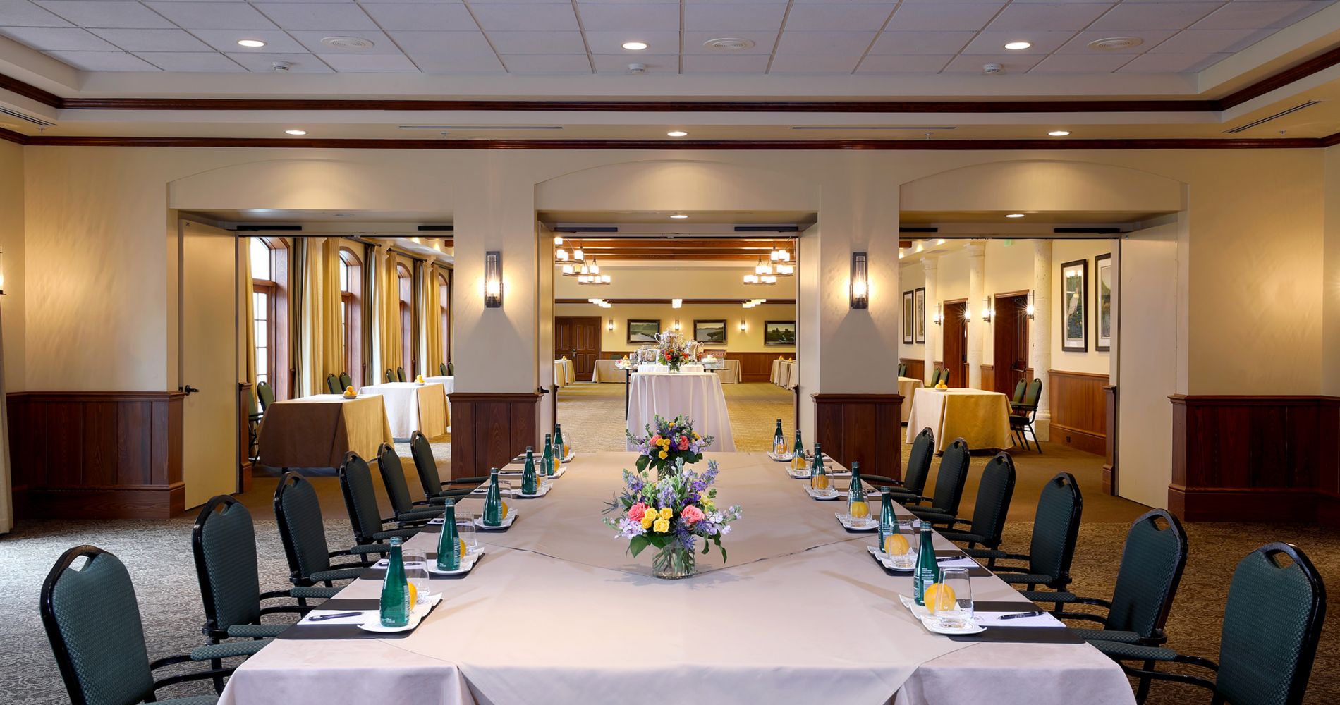 View of a set up meeting table from the end of the table