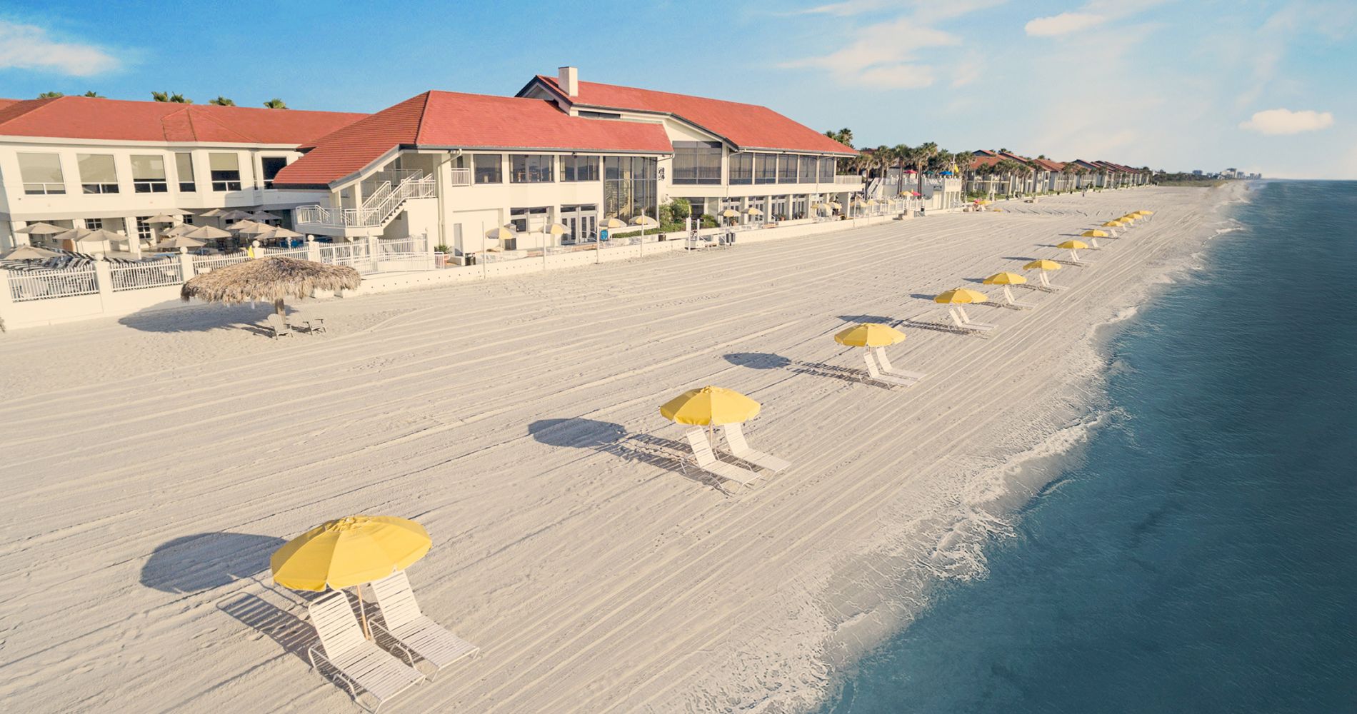 PVIC beach front with yellow umbrellas