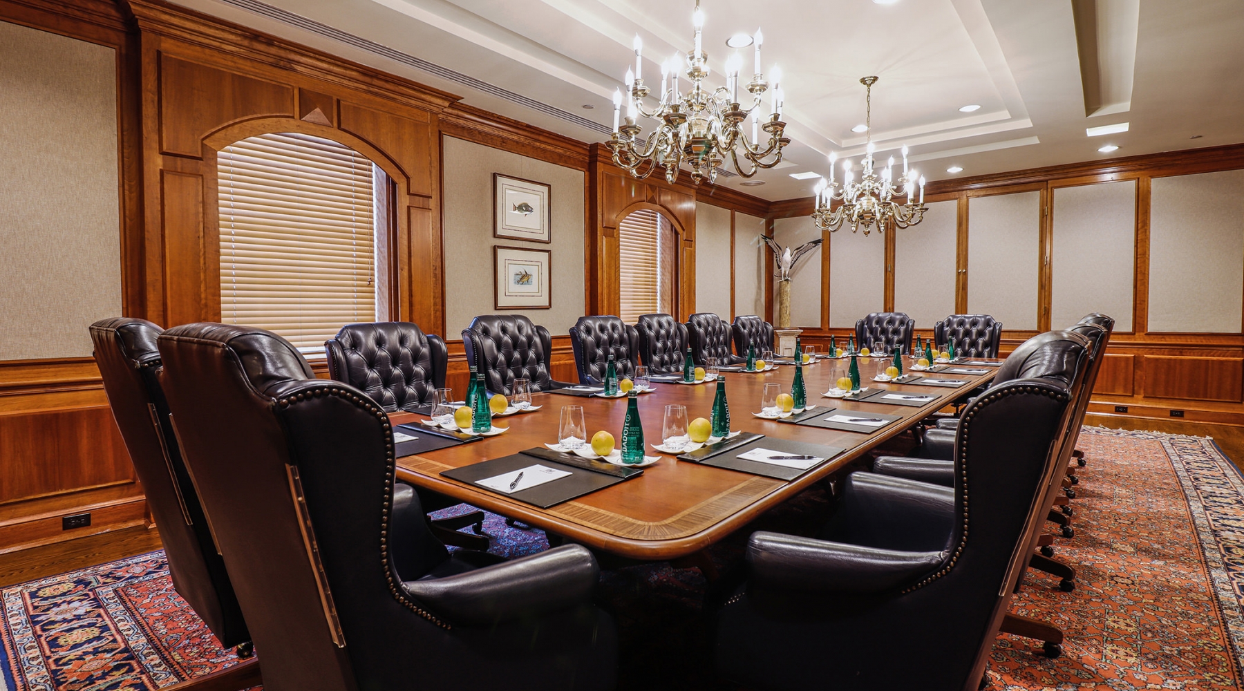 Large boardroom prepped for a meeting with luxurious leather chairs