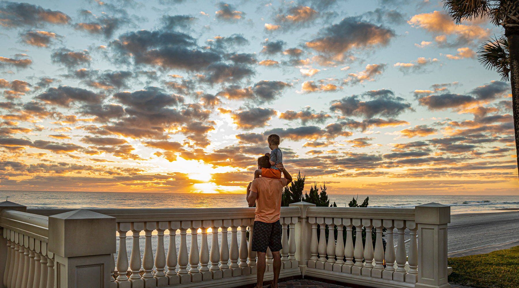 Man and Son Oceanfront Sunrise